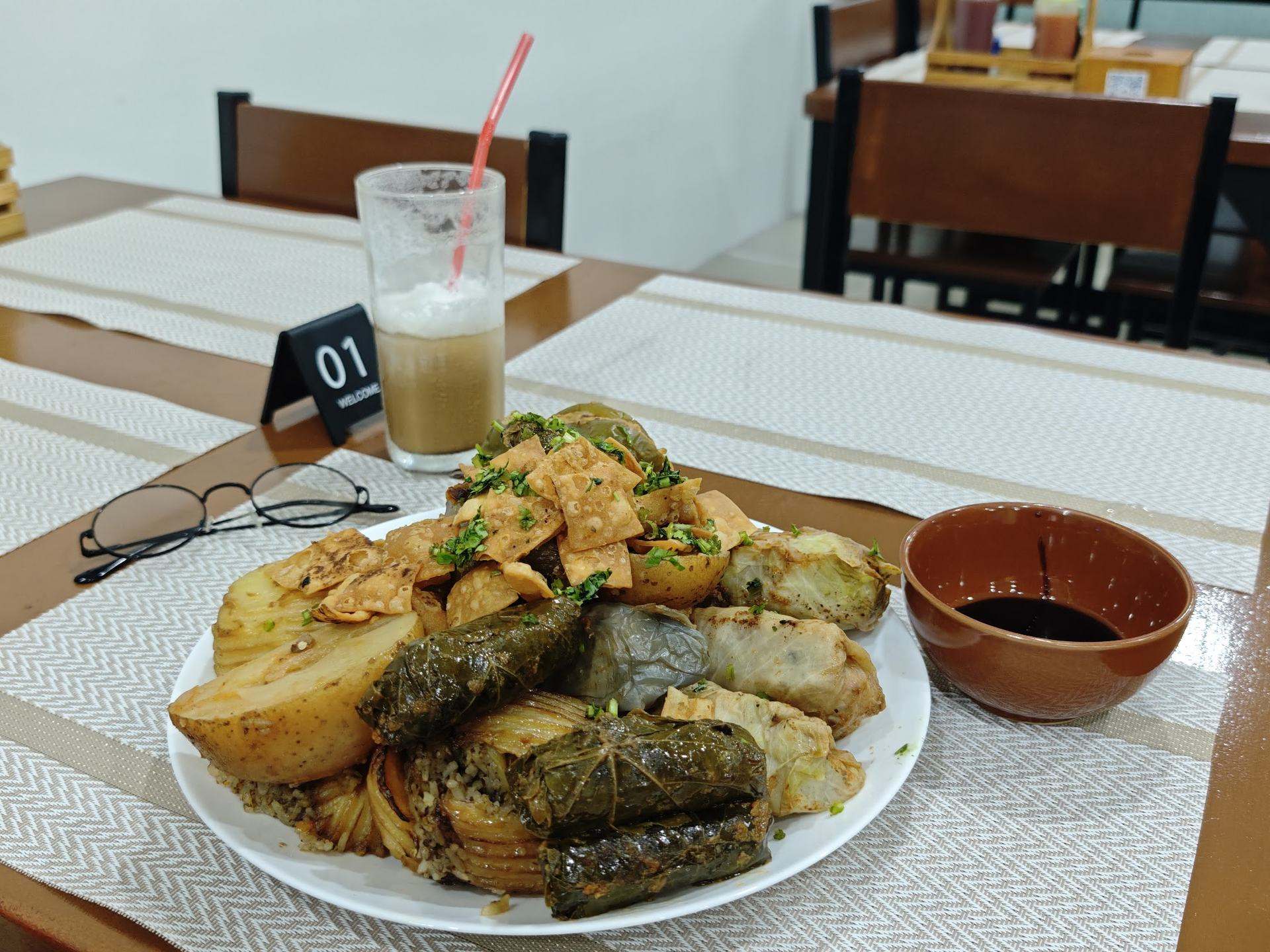 A feasting platter of dolma and mahshi — stuffed vine leaves and vegetables